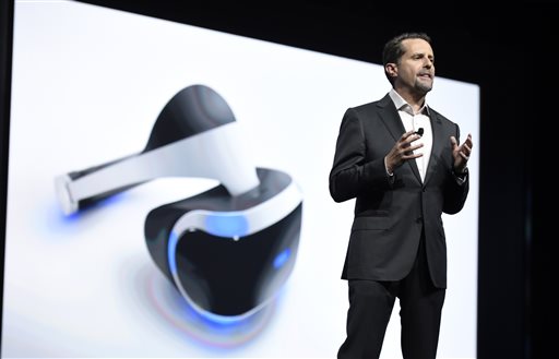 FILE - In this June 15, 2015 file photo, Andrew House, president and global CEO of Sony Computer Entertainment Inc., talks about the Sony Morpheus virtual reality headset at the Sony Playstation at E3 2015 news conference in Los Angeles. From virtual reality to the latest installments of "Gears of War" and "Battlefield," the newest hardware and software will be hyped by nearly 300 exhibitors at the Electronic Entertainment Expo, the gaming industry's annual trade show kicking off Sunday, June 12, 2016. (Photo by Chris Pizzello/Invision/AP, File)